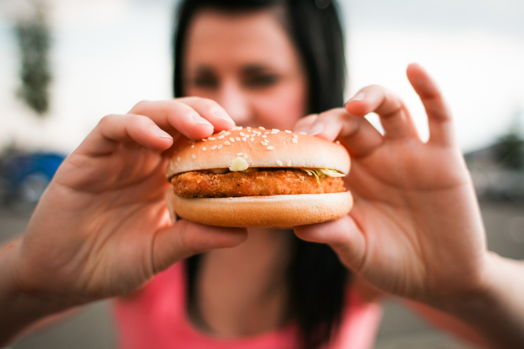 girl-holding-hamburger-in-her-hands-picjumbo-com